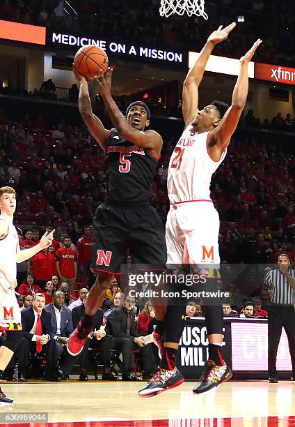 Nebraska Cornhuskers guard Glynn Watson Jr. Moves past Maryland Terrapins forward Justin Jackson for a shot during a Big 10 men's basketball game on...