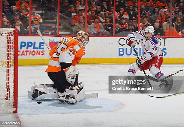 Chris Kreider of the New York Rangers scores at 5:01 of the third period against Steve Mason of the Philadelphia Flyers at the Wells Fargo Center on...