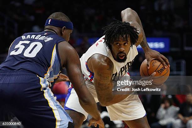 DeAndre Jordan of the Los Angeles Clippers looks to go around Zach Randolph of the Memphis Grizzlies during a game against the Memphis Grizzlies at...