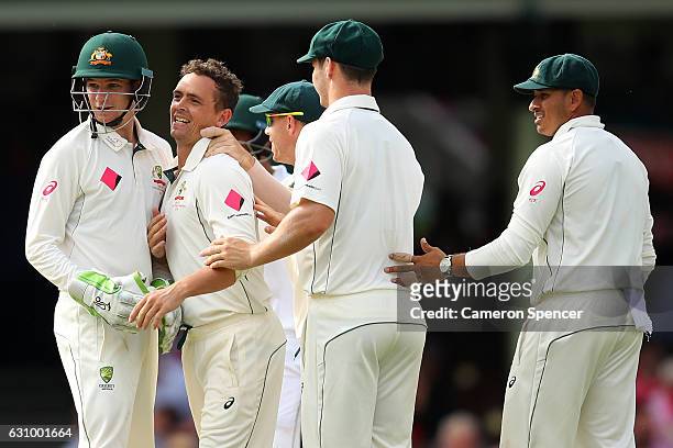Steve O'Keefe of Australia celebrates with team mates after dismissing Asad Shafiq of Pakistan during day three of the Third Test match between...