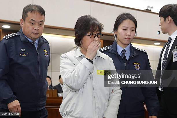 Choi Soon-Sil , the jailed confidante of disgraced South Korean President Park Geun-Hye, appears on the first day of her trial at the Seoul Central...