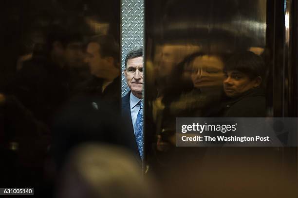 Retired Lt. Gen. Michael Flynn, President-elect Donald Trump's pick for National Security Adviser boards an elevator at Trump Tower in New York, NY...