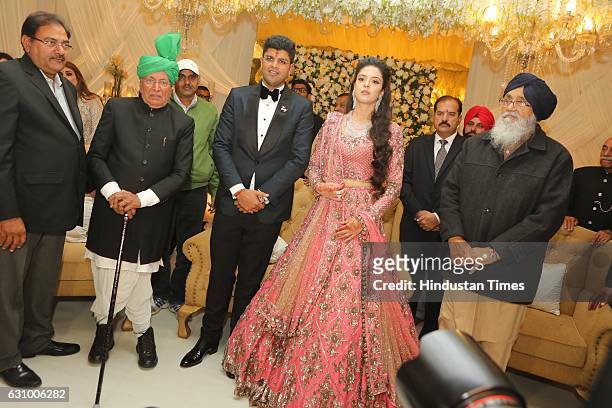 Former Haryana Chief Minister Om Prakash Chautala along with his grandson and MP from Hisar Dushyant Chautala and Meghna Ahlawat, daughter of IPS...