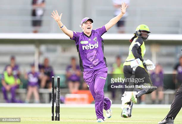Heather Knight of the Hurricanes appeals as Stafanie Taylor of the Thunder is run out during the Women's Big Bash League match between the Sydney...