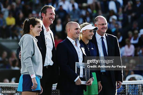 Tournament Director Karl Budge receives a plate from WTA CEO Steve Simon for winning the WTA International Tournaments of the Year on day four of the...