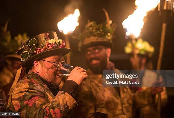 Members of the Leominster Morris lead the crowd from the Hobson Brewery in Frith Common to the nearby apple orchard to take part in a torchlit...