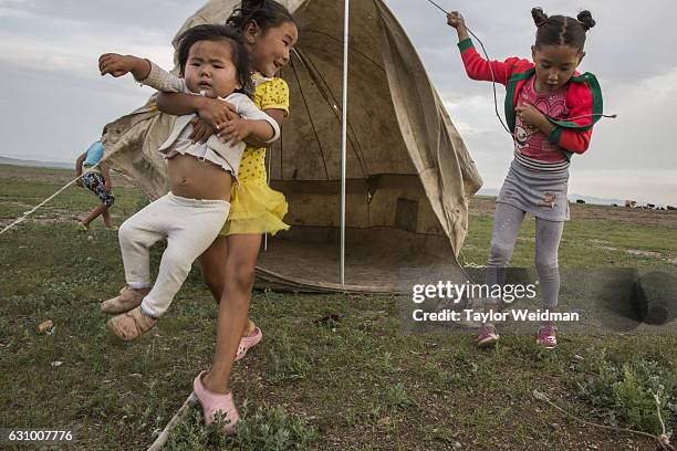 Children play outside their home in Altanbulag, Mongolia on July 28, 2016. This herding family has recently begun accepting guests via Airbnb.