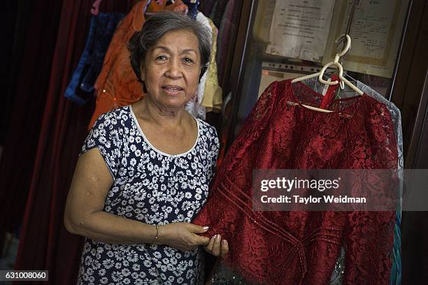 Portrait of Sok Kha taken in her tailor shop.