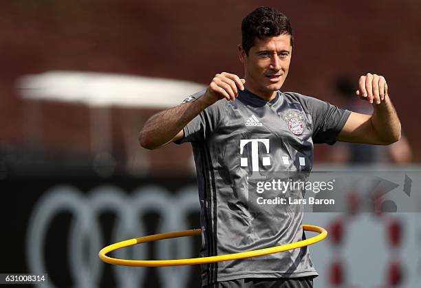 Robert Lewandowski tries a hula hoop dance during a training session at day 3 of the Bayern Muenchen training camp at Aspire Academy on January 5,...