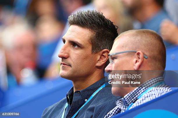 Former AFL player for the Fremantle Dockers Matthew Pavlich watches the men's singles match between Jack Sock of the United States and Nick Kyrgios...