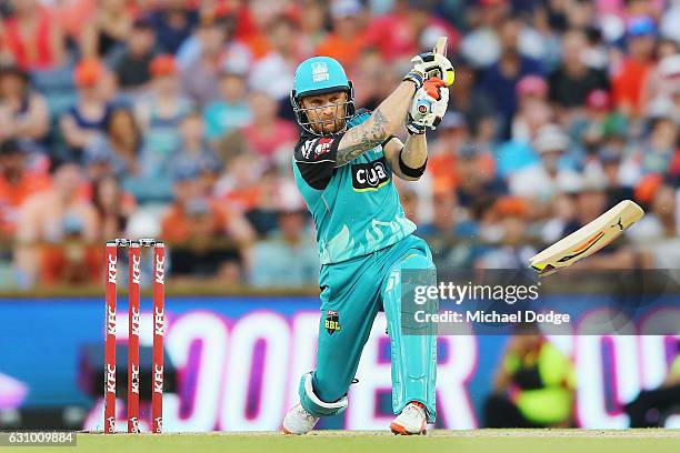 Brendon McCullum of the Heat breaks his bat from this stroke during the Big Bash League match between the Perth Scorchers and the Brisbane Heat at...