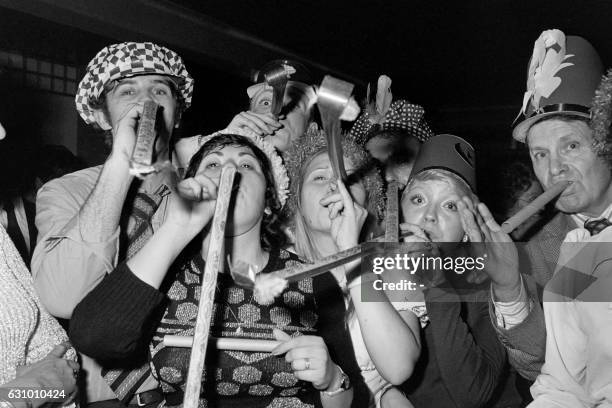 People celebrate the new year eve on December 31, 1974 in a nightclub in Paris.