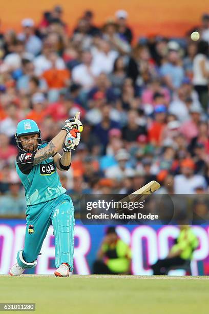 Brendon McCullum of the Heat breaks his bat from this stroke during the Big Bash League match between the Perth Scorchers and the Brisbane Heat at...