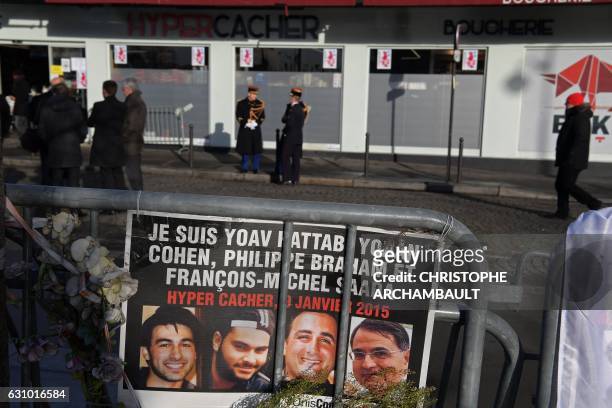 Republican guards stand outside the Hyper Cacher supermarket ahead of a ceremony marking the second anniversary of the deadly attack against the...
