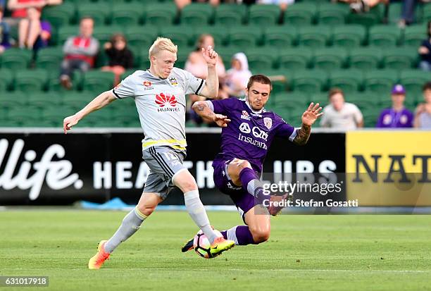 Adam Parkhouse of the Phoenix and Josh Risdon of the Glory compete for the ball during the round 14 A-League match between the Perth Glory and the...