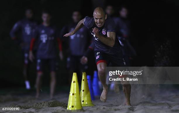 Arjen Robben sprints in the sand during a training session at day 3 of the Bayern Muenchen training camp at Aspire Academy on January 5, 2017 in...