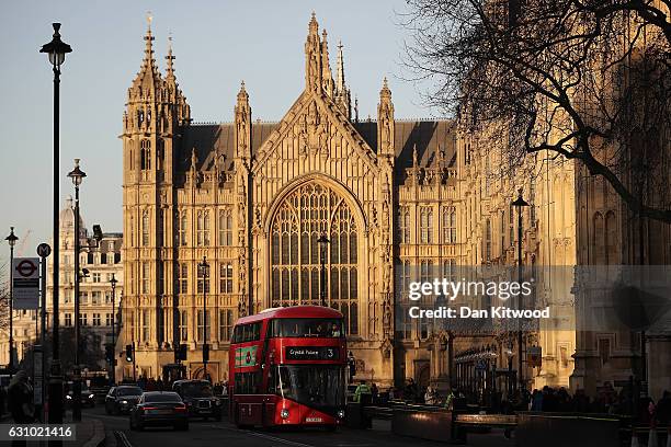 Routemaster bus drives past the Houses of Parliament in Westminster on January 5, 2017 in London, England. TFL, Transport for London has confirmed it...