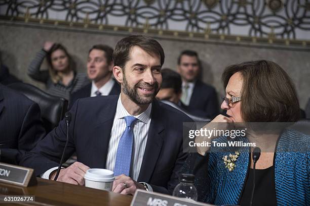 Sens. Tom Cotton, R-Ark., and Deb Fischer, R-Neb., talk before a Senate Armed Services Committee hearing in Dirksen Building titled "Foreign Cyber...