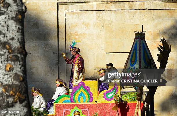 Participants on a float wait for the start of the Three Wise Men Parade in Sevilla on January 5 marking the eve of Epiphany. Each year, parades are...
