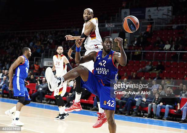 Bryant Dunston, #42 of Anadolu Efes Istanbul competes with Alex Tyus, #7 of Galatasaray Odeabank Istanbul during the 2016/2017 Turkish Airlines...
