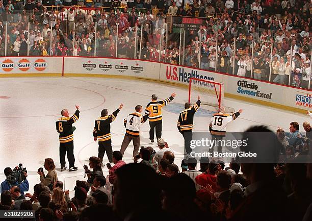 Group of former Boston Bruins, including Ken Hodge , Phil Esposito , Bobby Orr , Johhny McKenzie , Fred Stanfield and Johhny Bucyck , wave to the...