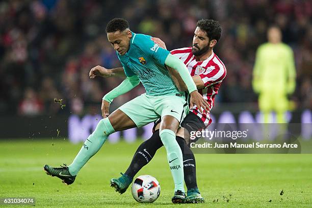 Neymar of FC Barcelona duels for the ball with Raul Garcia of Athletic Club during the Copa del Rey Round of 16 first leg match between Athletic Club...