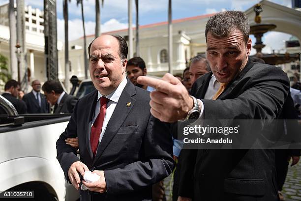 Opposition's parliamentary leader Julio Borges arrives to attend the swearing-in ceremony for outgoing assembly speaker Henry Ramos Allup is due to...