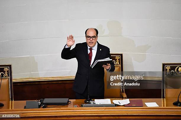Opposition's parliamentary leader Julio Borges swears-in as President of the National Assembly during the swearing-in ceremony for outgoing assembly...