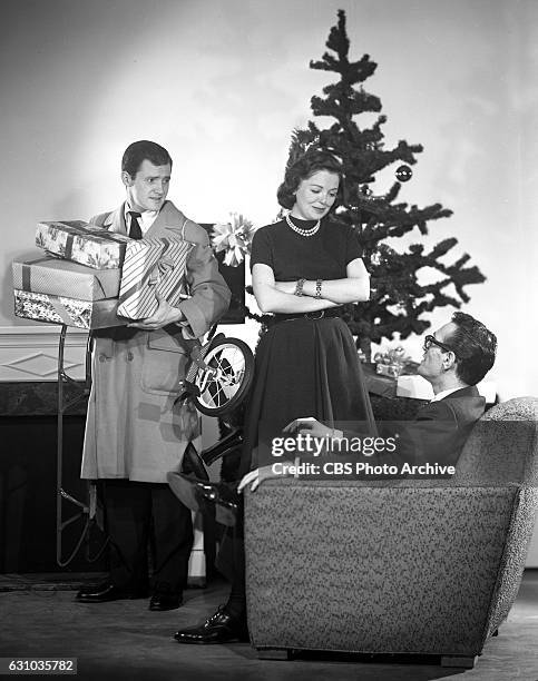 Televisions Studio One featuring Orson Bean , Kathleen McGuire , and Robert Q. Lewis in A Christmas Surprise. The production resembles an interview...