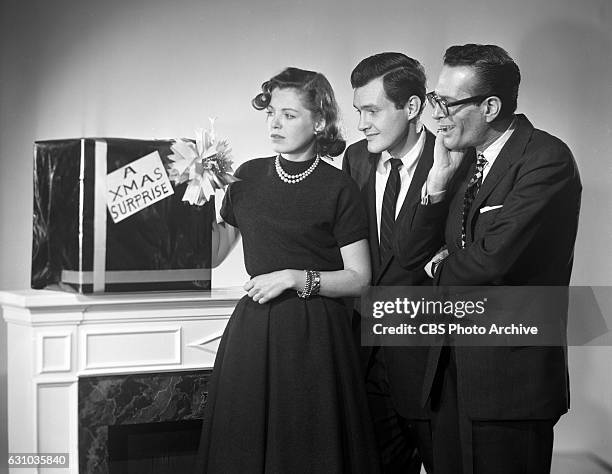 Televisions Studio One featuring Kathleen McGuire , Orson Bean , and Robert Q. Lewis in A Christmas Surprise. The production resembles an interview...