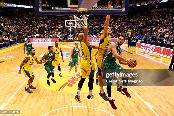 Semih Erden, #9 of Darussafaka Dogus Istanbul competes with Devin Smith, #6 of Maccabi Fox Tel Aviv during the 2016/2017 Turkish Airlines EuroLeague...