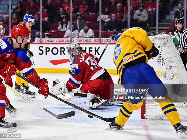 Carl Grundstrom of Team Sweden misses his shot on goaltender Ilya Samsonov of Team Russia during the 2017 IIHF World Junior Championship bronze medal...