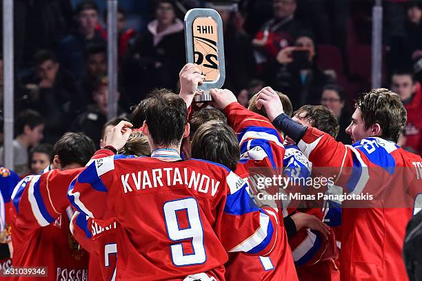 Team Russia celebrate their victory with the IIHF bronze trophy during the 2017 IIHF World Junior Championship bronze medal game against Team Sweden...