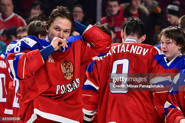 Kirill Urakov of Team Russia kisses his bronze medal during the 2017 IIHF World Junior Championship bronze medal game against Team Sweden at the Bell...