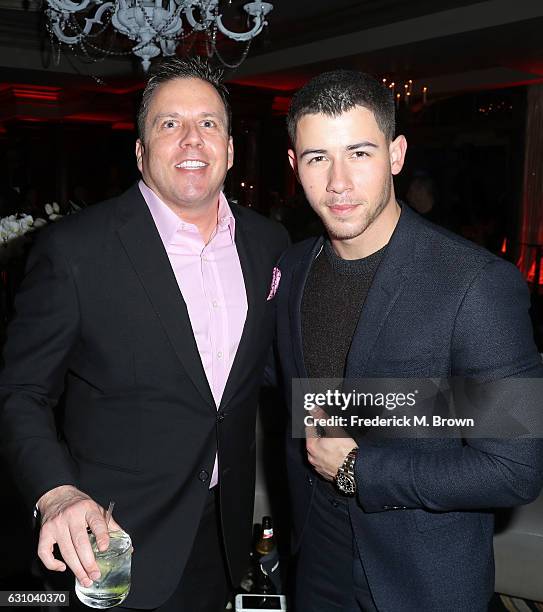 Chris Long, SVP of Entertainment and Production at Audience Network, DirecTV and actor/singer Nick Jonas attend the DirecTV Cocktail Reception during...