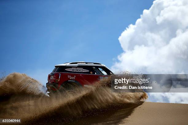 Mikko Hirvonen of Finland and Mini X-Raid drives with co-driver Michel Perin of France in the John Cooper Works Rally Mini car in the Classe : T1.2 :...