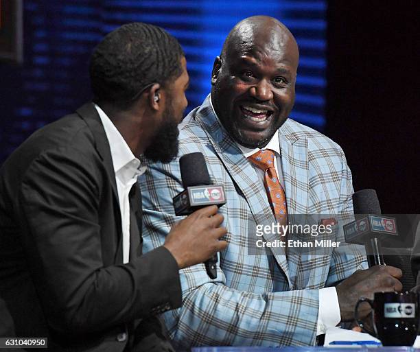 Analyst Shaquille O'Neal laughs as he interviews center fielder Dexter Fowler of the St. Louis Cardinals during a live telecast of "NBA on TNT" at...