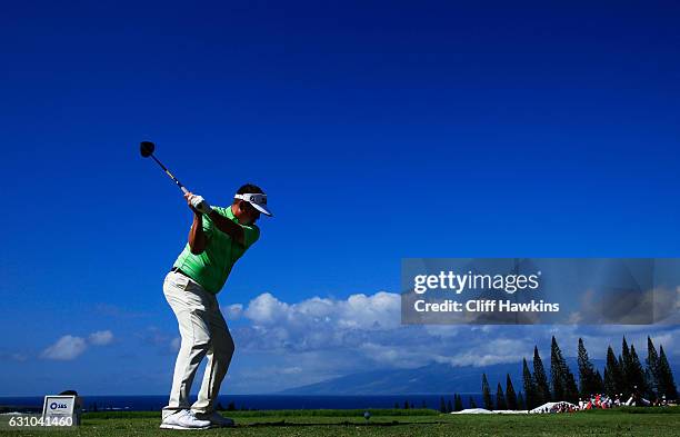 Jason Dufner of the United States plays his shot from the first tee during the first round of the SBS Tournament of Champions at the Plantation...