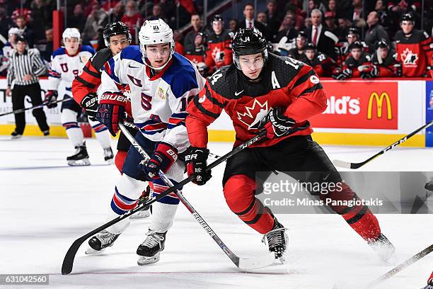 Clayton Keller of Team United States and Mathew Barzal of Team Canada skate against one another during the 2017 IIHF World Junior Championship gold...