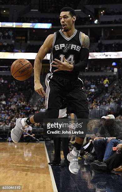 San Antonio Spurs guard Danny Green saves the ball from going out of bounds during the second quarter against the Denver Nuggets January 5, 2016 at...