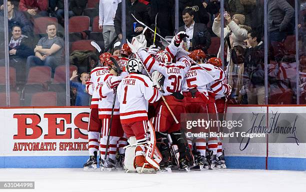 Jakob Forsbacka Karlsson of the Boston University Terriers celebrates his overtime winning goal, his third goal of the game, against the Union...