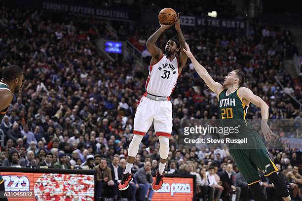 Toronto Raptors forward Terrence Ross puts up a three pointer against Gordon Hayward as the Toronto Raptors beat the Utah Jazz 101-93 at Air Canada...