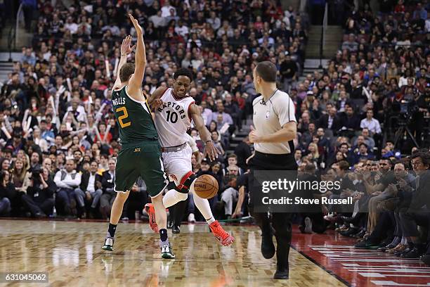 Utah Jazz forward Joe Ingles fouls Toronto Raptors guard DeMar DeRozan as the Toronto Raptors beat the Utah Jazz 101-93 at Air Canada Centre in...