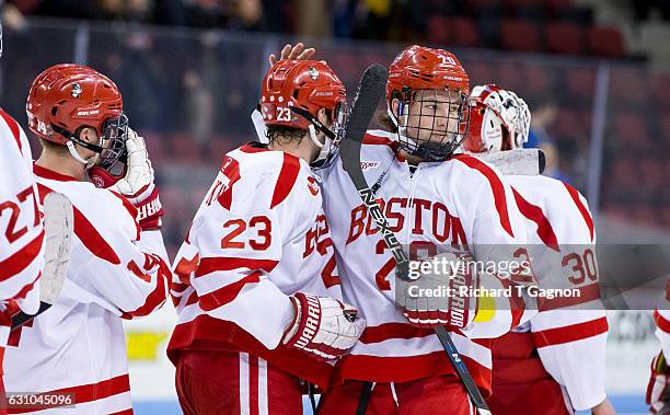 Jakob Forsbacka Karlsson of the Boston University Terriers celebrates his overtime winning goal, his third goal of the game, against the Union...
