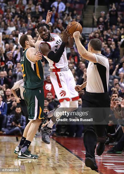 Toronto Raptors forward DeMarre Carroll is fouled by Utah Jazz forward Joe Ingles as the Toronto Raptors beat the Utah Jazz 101-93 at Air Canada...