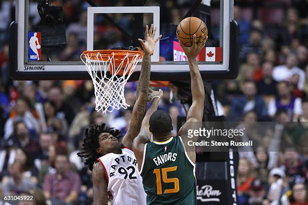 Toronto Raptors center Lucas Nogueira defends against Utah Jazz forward Derrick Favors as the Toronto Raptors beat the Utah Jazz 101-93 at Air Canada...