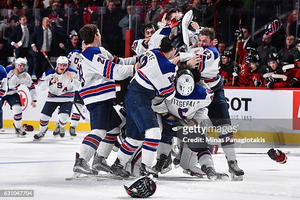 Team United States celebrate as they win gold during the 2017 IIHF World Junior Championship gold medal game against Team Canada at the Bell Centre...