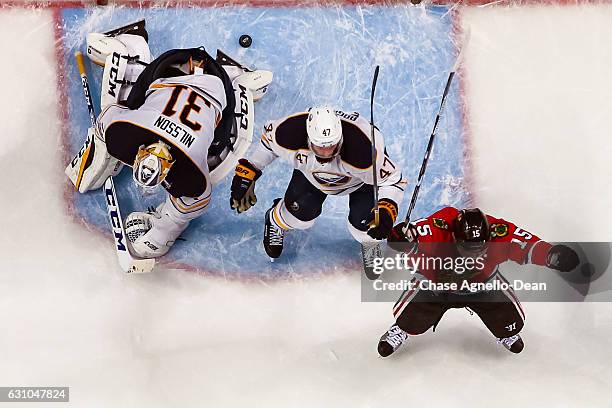 Artem Anisimov of the Chicago Blackhawks reacts after scoring on goalie Anders Nilsson of the Buffalo Sabres in the third period to tie the game 3-3...