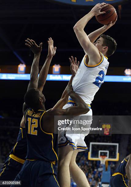 Bruins TJ Leaf goes up for a shot over California Golden Bears Roger Moute A Bidias during the game on January 05 at the Pauley Pavilion in Los...