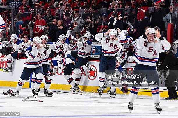 Team United States celebrate as they win gold against Team Canada during the 2017 IIHF World Junior Championship gold medal game at the Bell Centre...